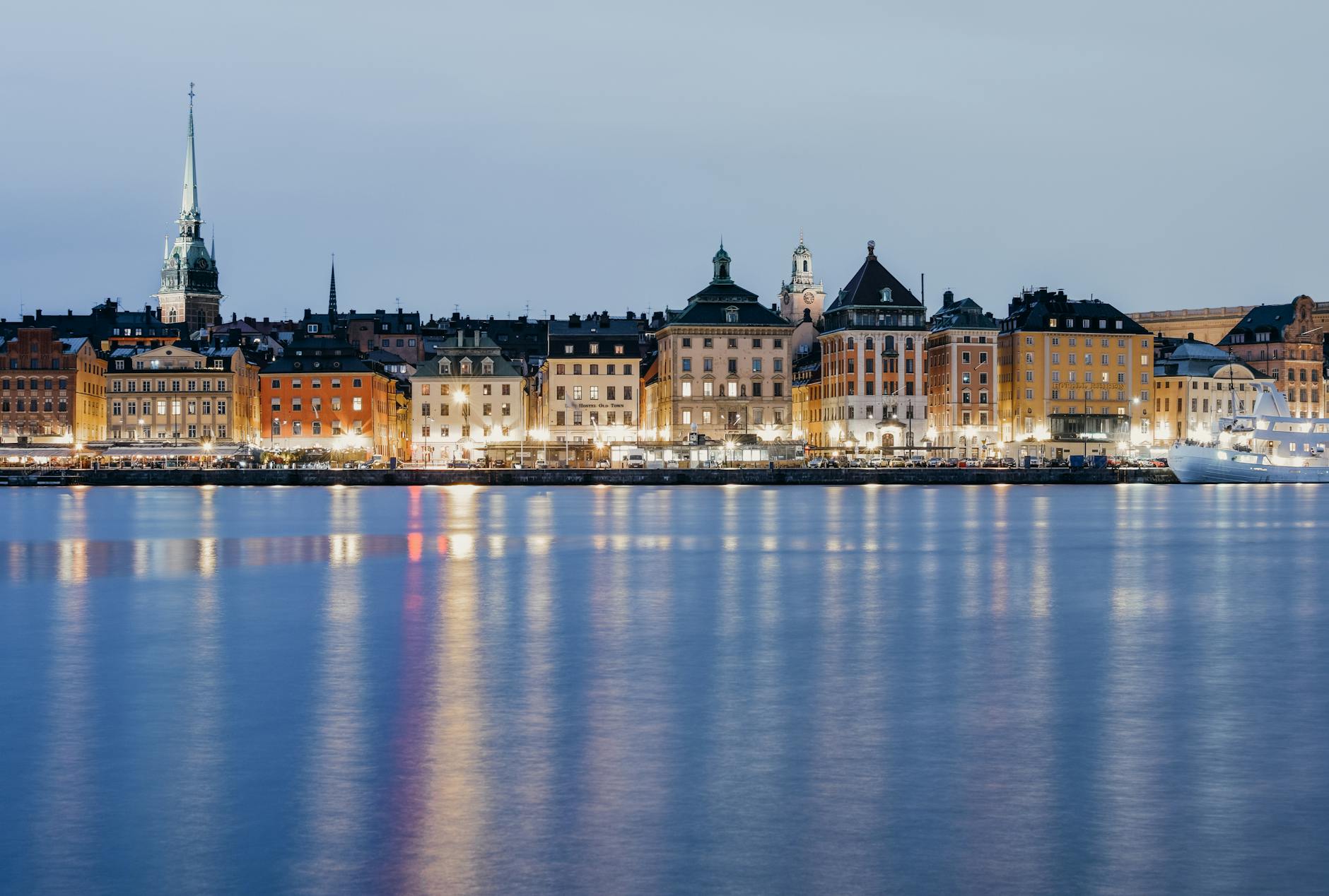 Cobblestone alleys and mustard-colored 17th-century buildings in Stockholm's Gamla Stan old town at twilight